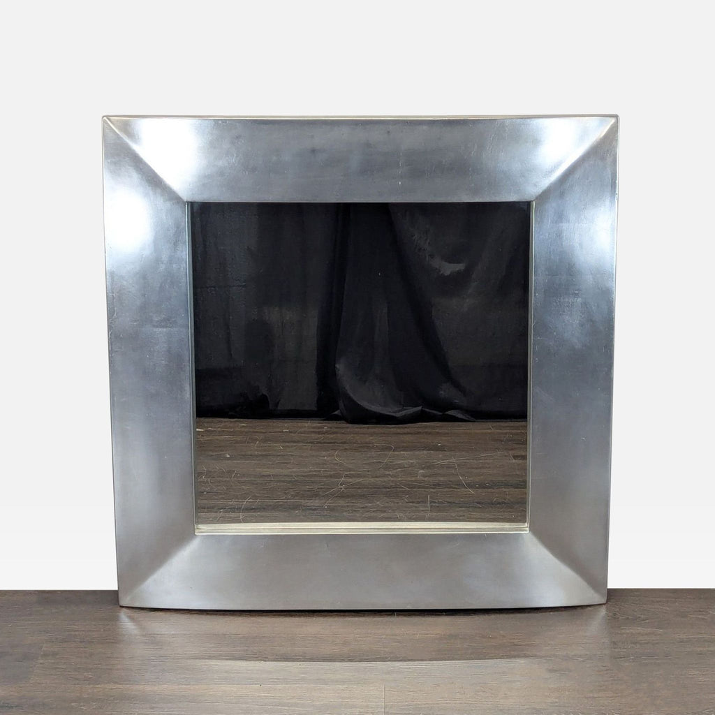 Round wall mirror with a slim metallic frame, ideal for modern home decor.