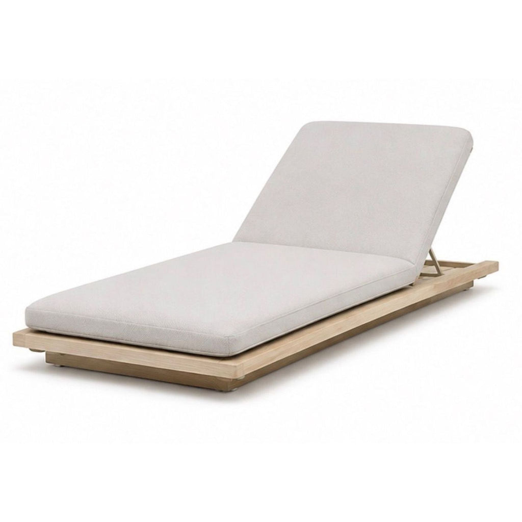 Modern blue chaise lounge with sleek, minimal design by Paola Lenti, part of the Sabi collection, made in 2015.  