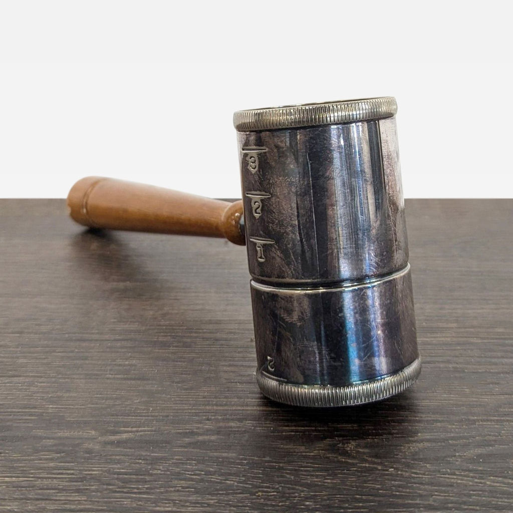 3. Silver-plated judge’s gavel cocktail jigger showing age-related tarnish and surface wear on metal and wood.