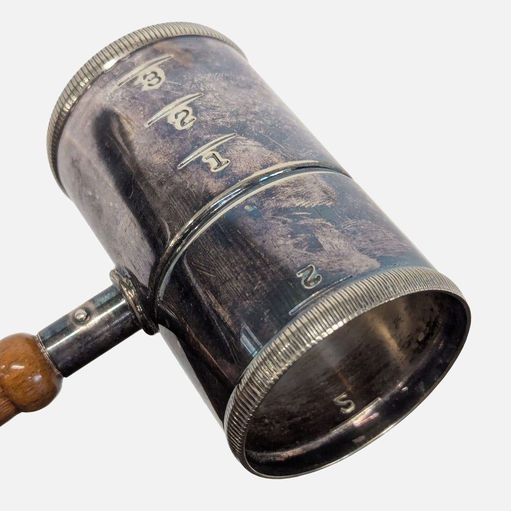 2. Art Deco era Napier gavel jigger with ribbed detailing, spirit measures, and worn silver and wood finishes.