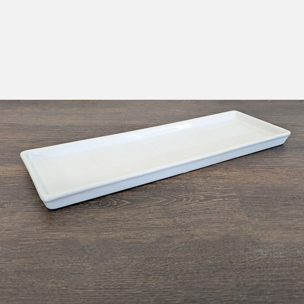 Certainly! However, as no image or specific description of the item has been provided, I'll generate three generalized alt texts suitable for a Pottery Barn dishware item. Please adjust details if you have a specific piece or image in mind.