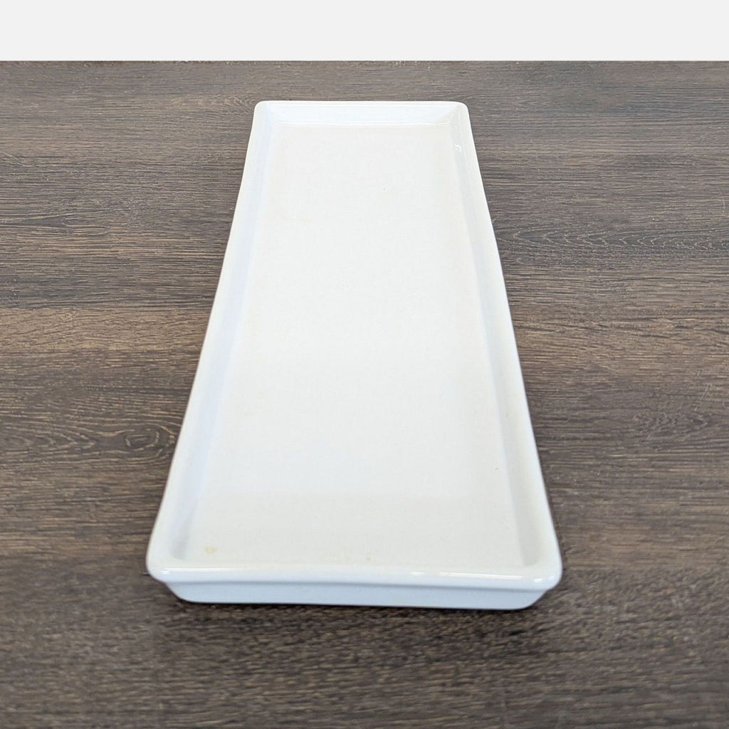 Elegant Pottery Barn ceramic dishware set with a rustic white glaze, ideal for modern dining.