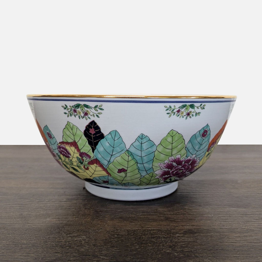 Decorative dishware: Gumps Japan bowl with multicolored floral motifs, leafy accents, and elegant gold rim.