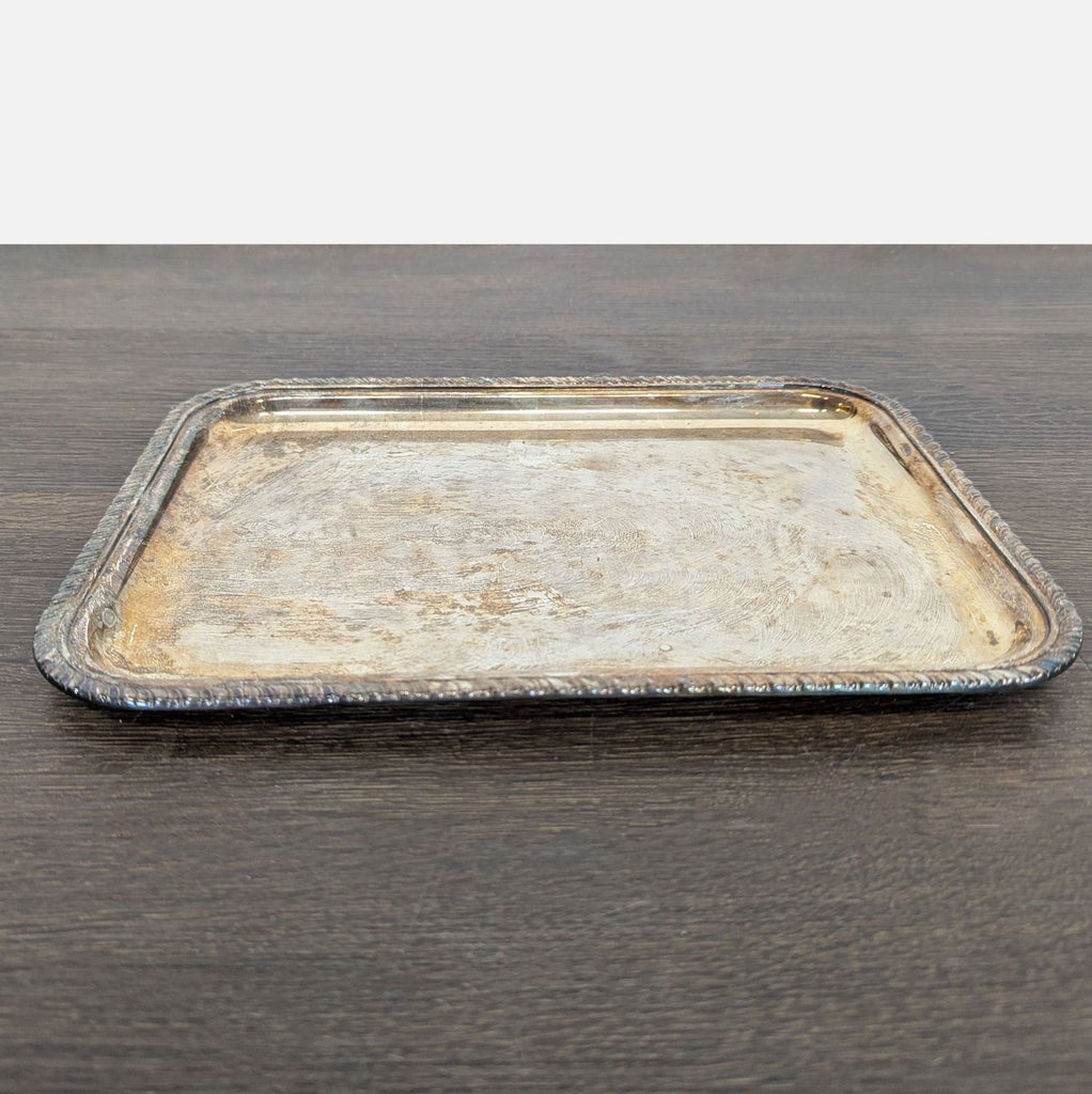 Classic rectangular serving tray, silver-plated with tarnished finish and decorative details, showcasing a charming aged look.