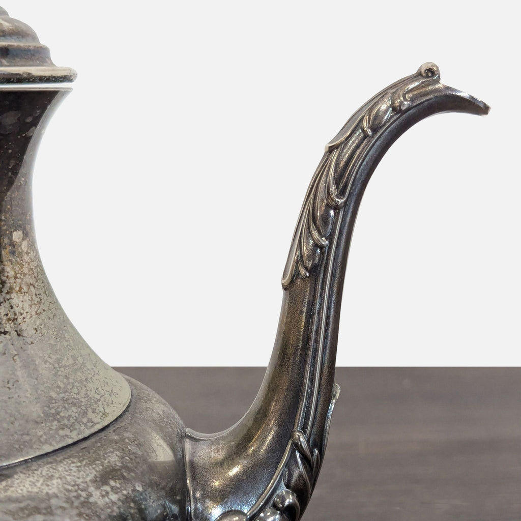 Vintage Silver-Plated Teapot with Ornate Handle and Spout