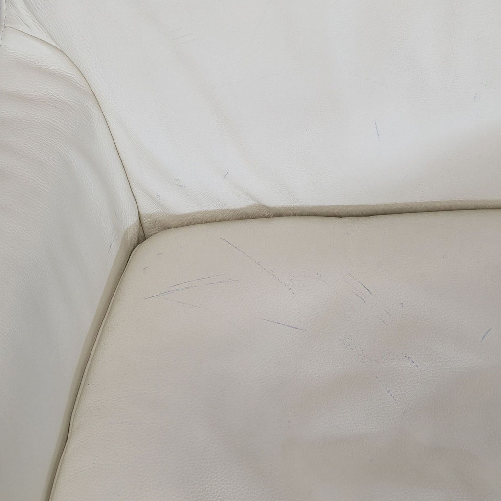 Ikea High-back white leather-look swivel lounge chair. 2019. I don't have the exact original price, but based on googling around it seems like it was roughly $400.