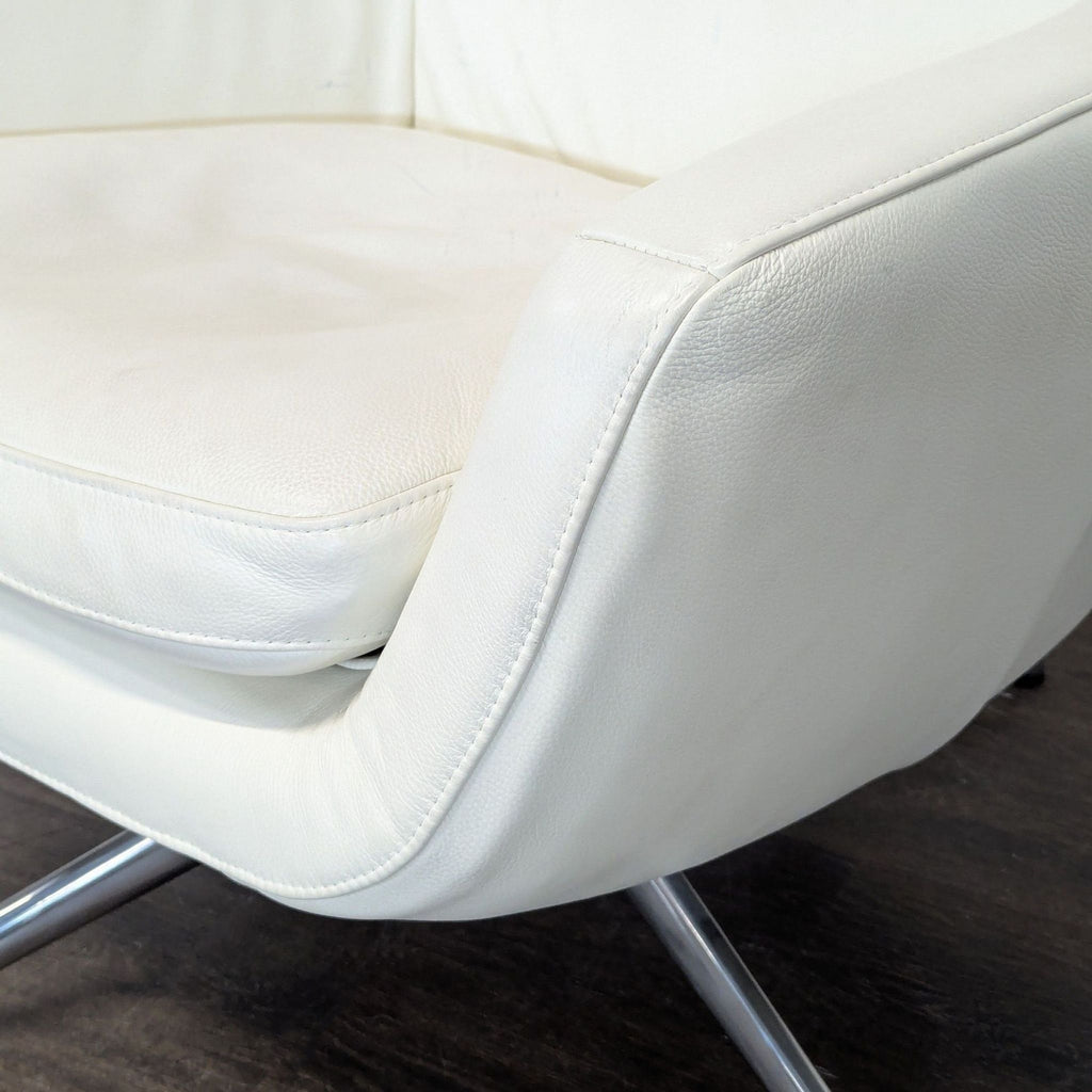 Ikea High-back white leather-look swivel lounge chair. 2019. I don't have the exact original price, but based on googling around it seems like it was roughly $400.