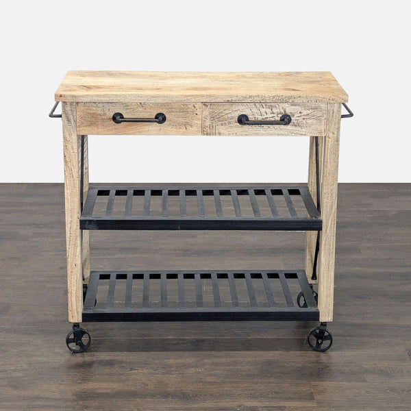 Kitchen cart with wooden top, two drawers, metal shelves, towel bars, and wheels for mobility.