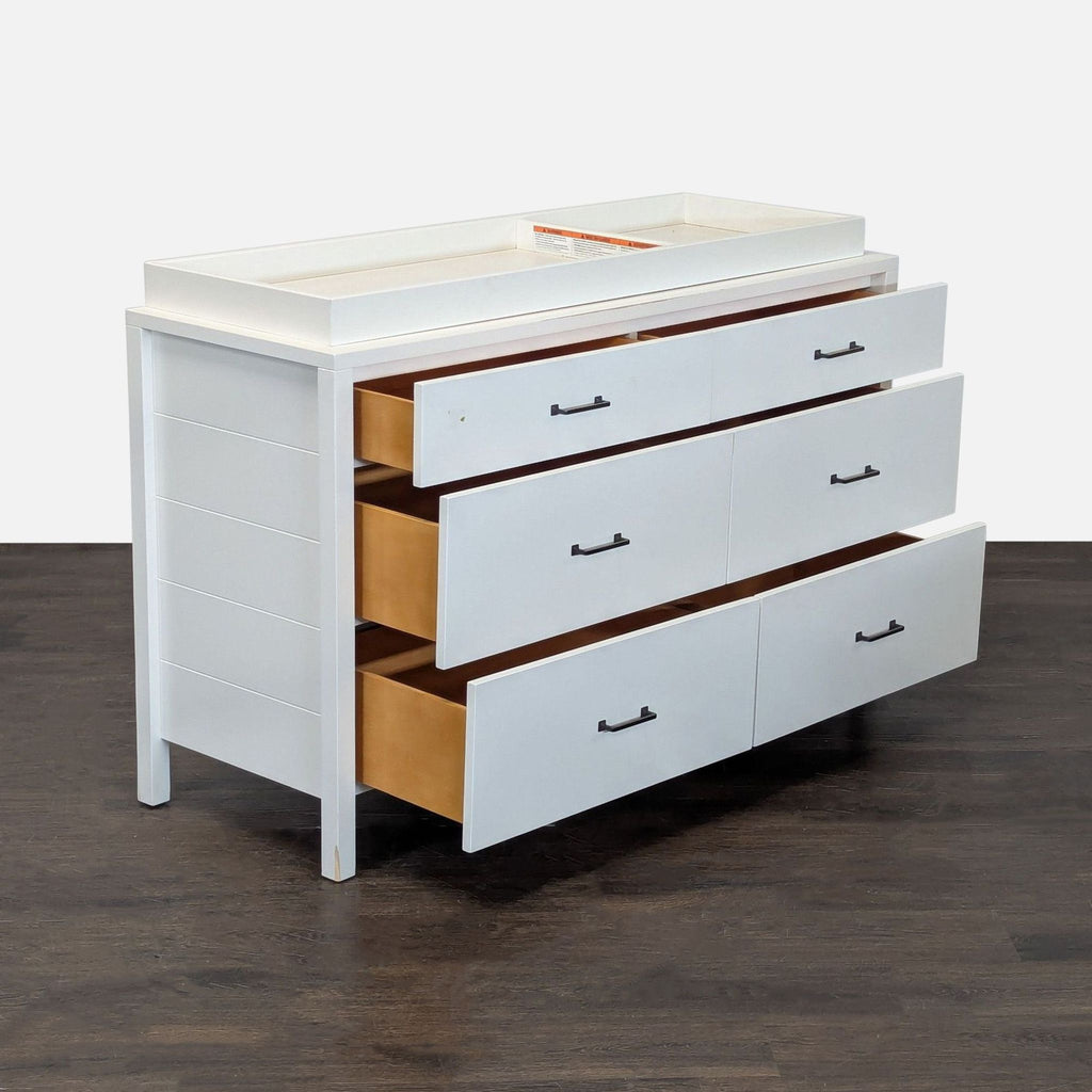 Six-drawer dresser by Pottery Barn Kids in white, featuring simple handles and a removable changing tray on top.