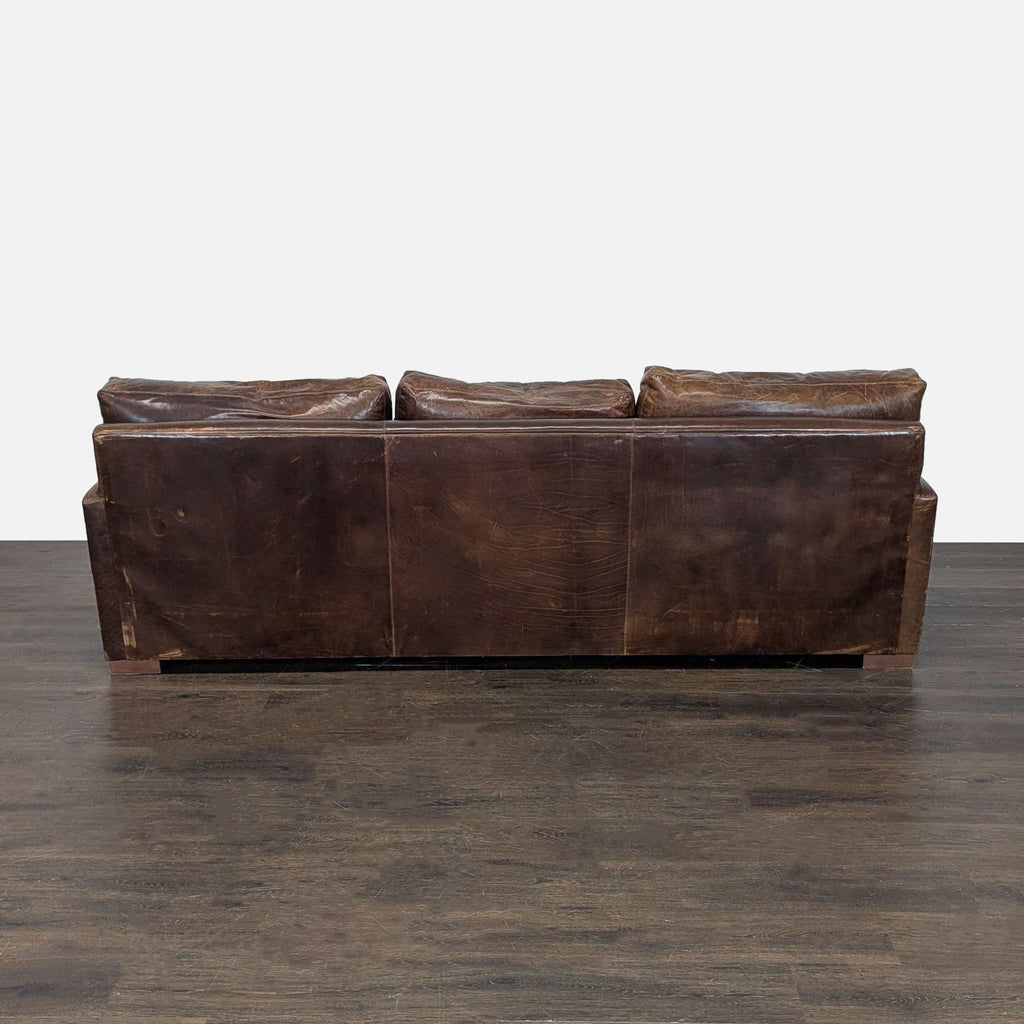 Contemporary 3-seater couch by Restoration Hardware, plush cushions, minimalist style.  