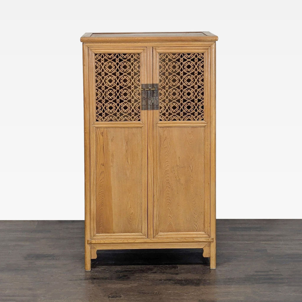 Illuminated cabinet with interior shelves, carved top door panels, and a locking pin.