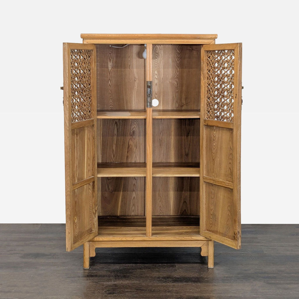 Cabinet featuring interior lighting, hand-carved upper doors, shelves, and secure locking pin.