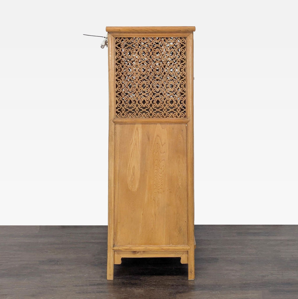 Hand-carved illuminated cabinet with shelves, decorative top doors, and locking pin mechanism.