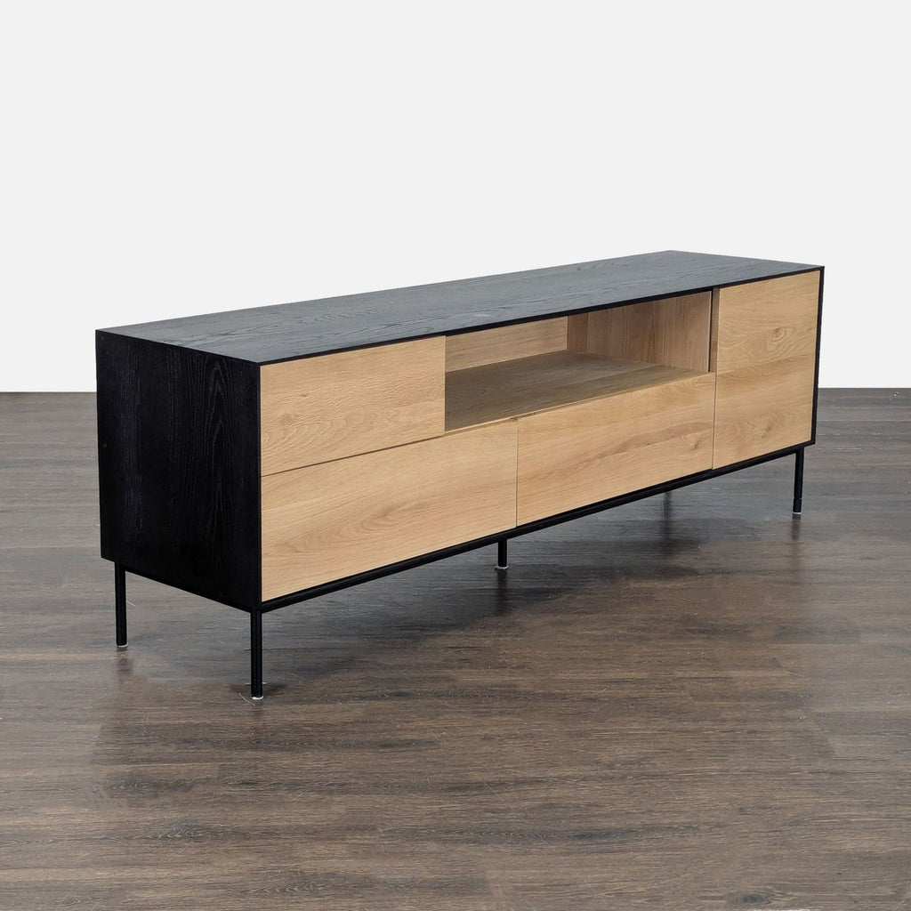 Contemporary media unit with storage drawers, drop-down area, double-door cabinet, and open electronics shelf.