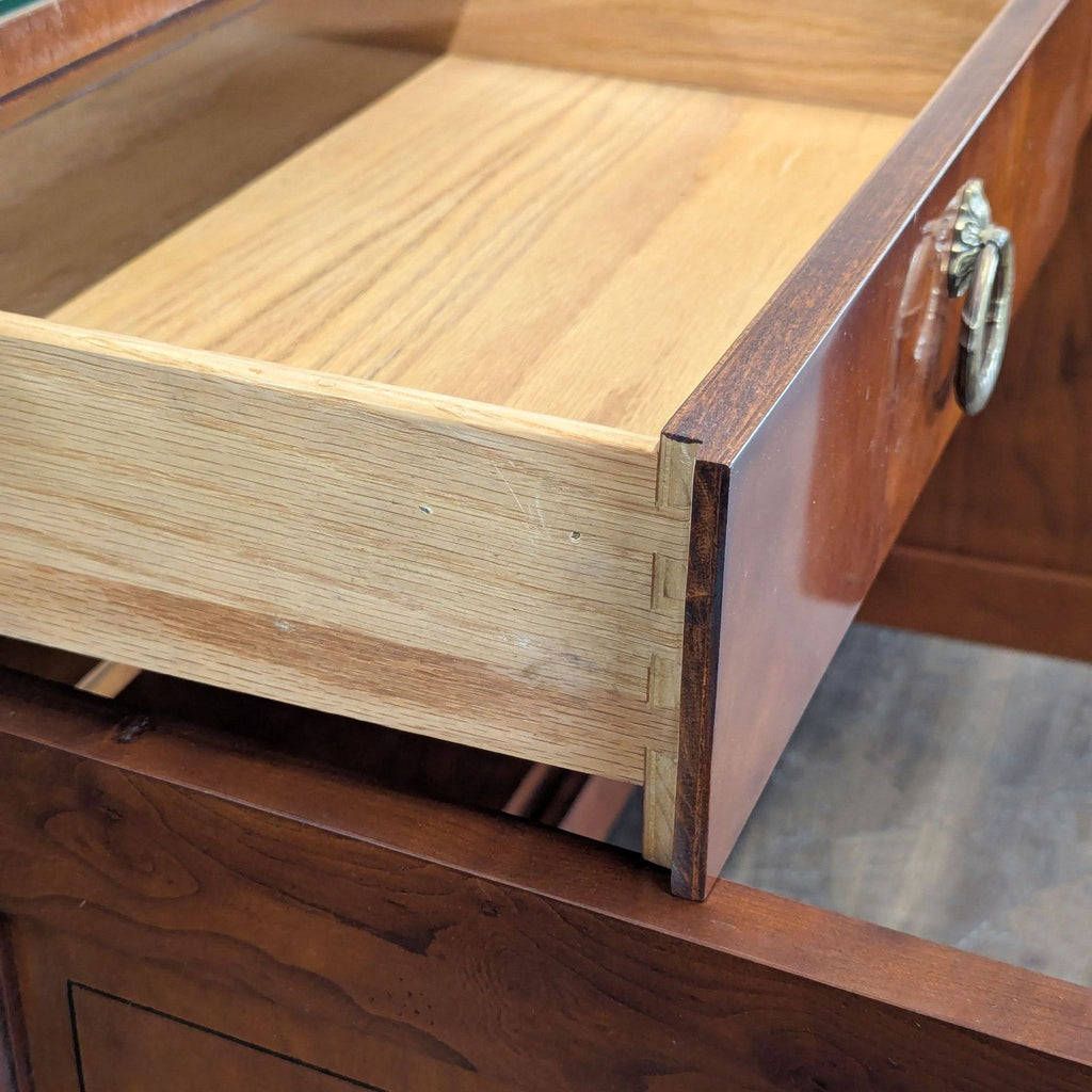 2. Baker Furniture credenza showcasing rich wood finish and sleek handles, ideal for stylish storage solutions.  