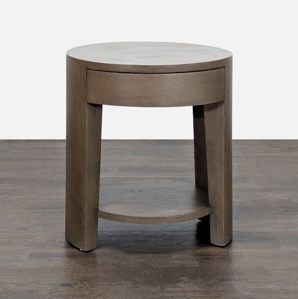 Wyeth Round Bedside table by Restoration Hardware, made of European white oak with a sculptural, tribal-inspired form.