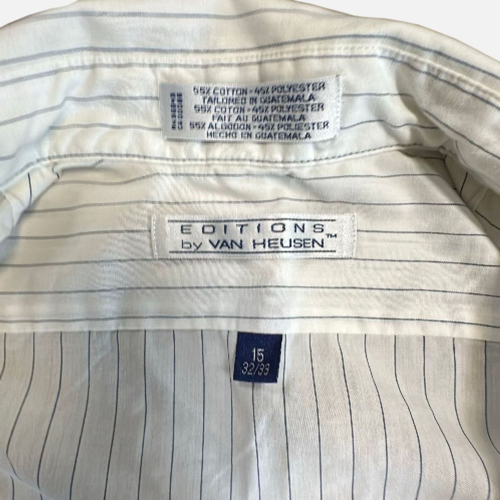 1. Van Heusen men's shirt in a classic style, neatly folded, highlighting its crisp fabric and tailored fit.