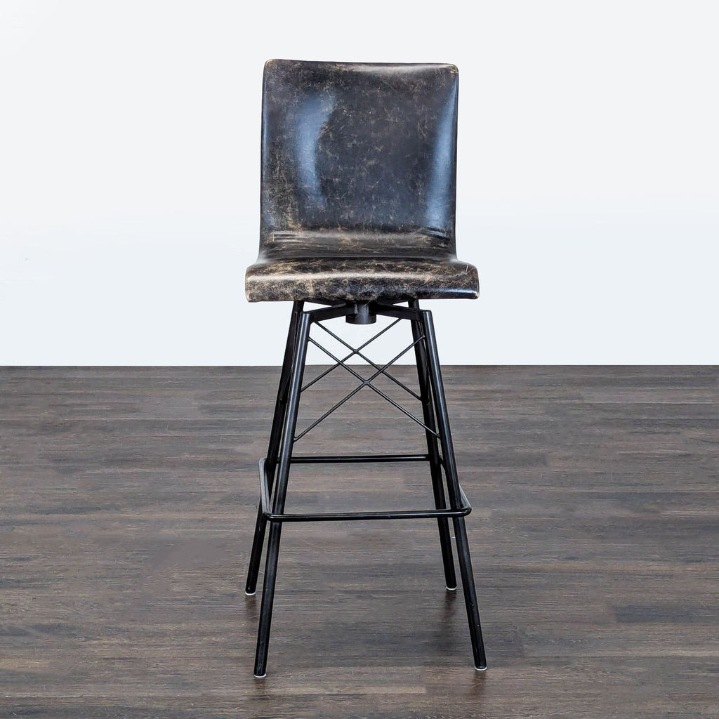 Leather stool with a metal base, designed by Four Hands, shown in the Stools, Ottomans & Benches category.  