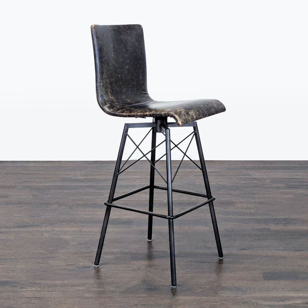 Modern bench by Four Hands featuring a leather seat atop a sturdy metal base, ideal for versatile seating.  
