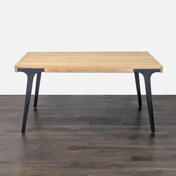White oak Crate & Barrel dining table with cast iron legs, seats 8 when extended to 99 inches.