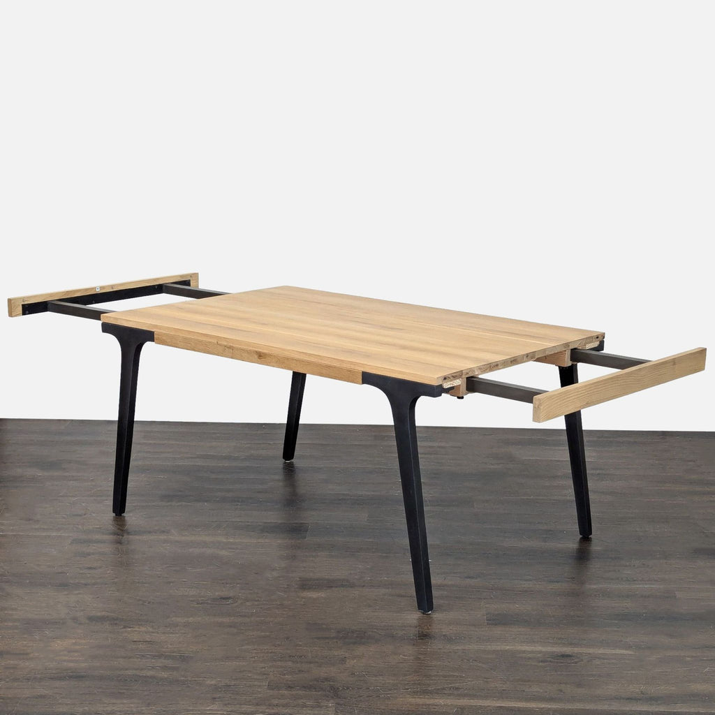 Crate & Barrel dining table in white oak, extendable to 99 inches with 2 leaves, seats up to 8.