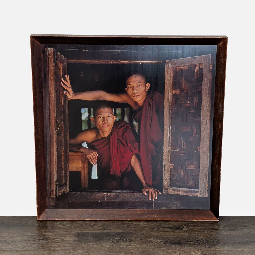 Framed print showing two Buddhist monks gazing out a window, conveying tranquility and rich cultural detail.