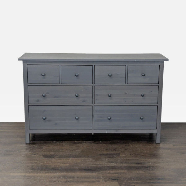 Modern gray Ikea dresser with 8 spacious drawers, ideal for organized bedroom or living room storage.