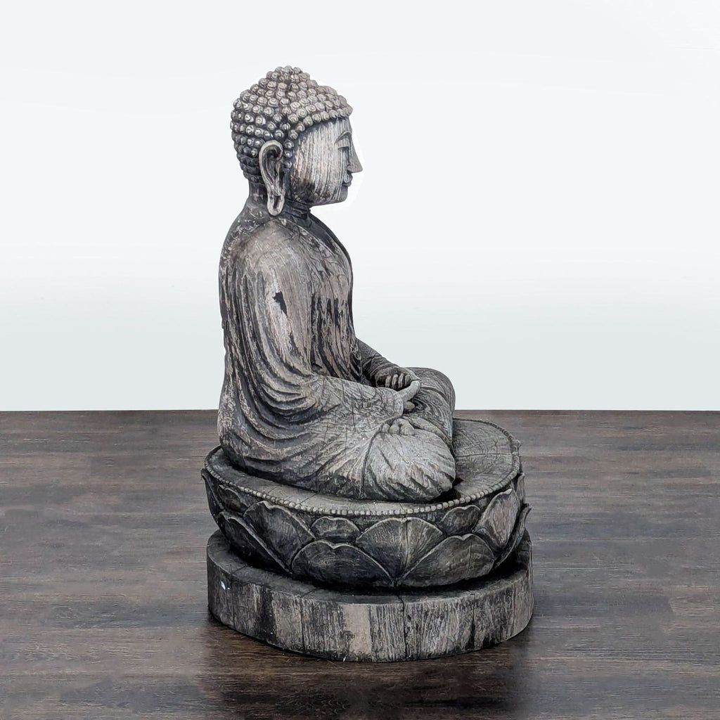 3. Profile of a rustic wooden Buddha statue seated in meditation on a lotus platform, showing detailed robes and serene expression.