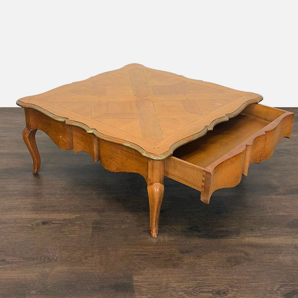 Classic wood coffee table with elegant curves and a parquet design, featuring a secret drawer.