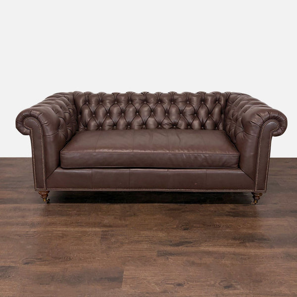Highland House 3-seat brown leather Chesterfield sofa with deep tufting and rolled arms.  