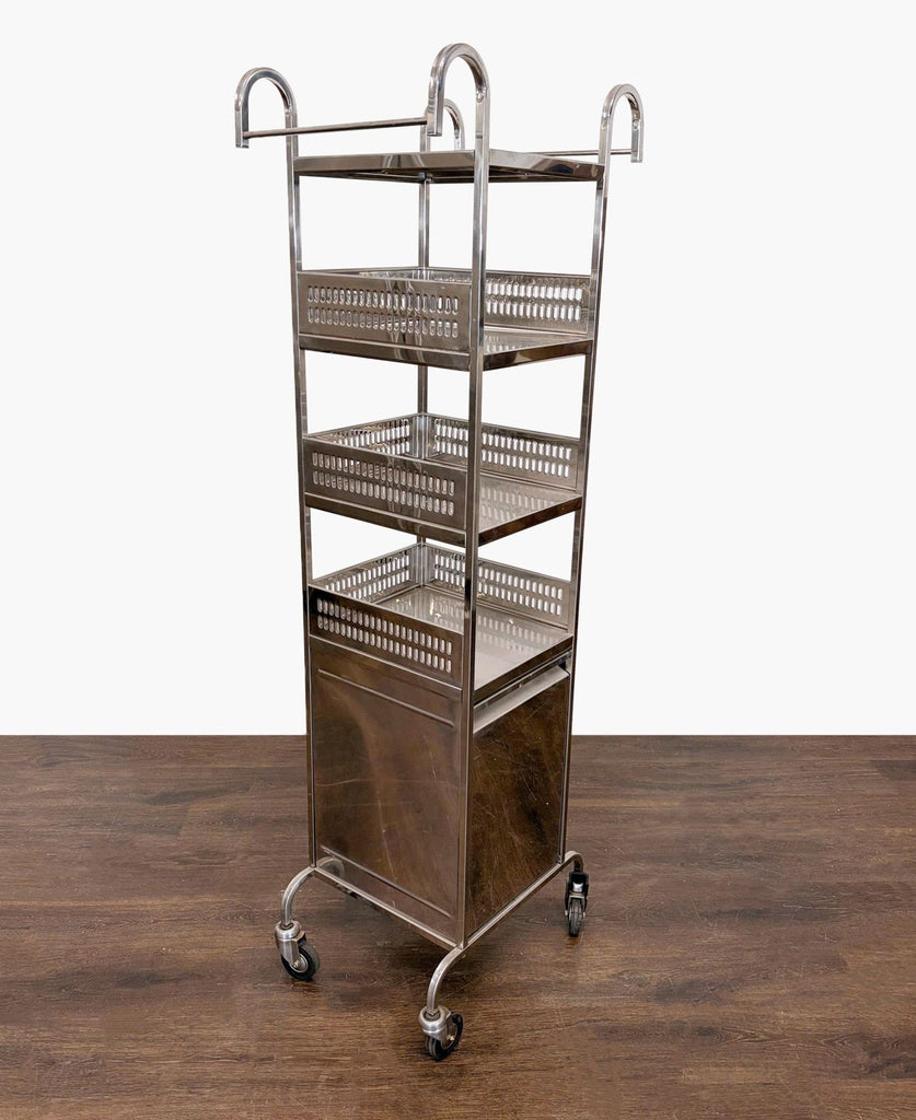 Sleek metal kitchen cart with multiple shelves and rolling wheels, perfect for accessible storage.