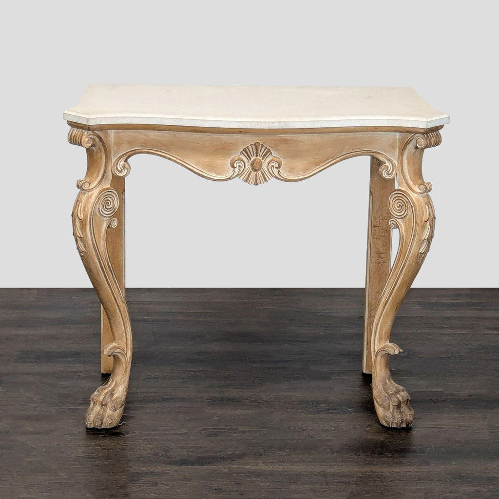 Stone-topped side table featuring intricately carved base, cabriole legs, and detailed paw feet design.  