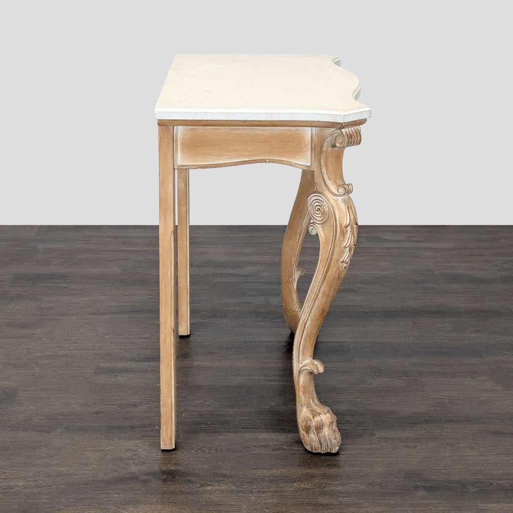 Console table with stone surface, decorative cabriole legs, and carved paw foot accents on the base.  