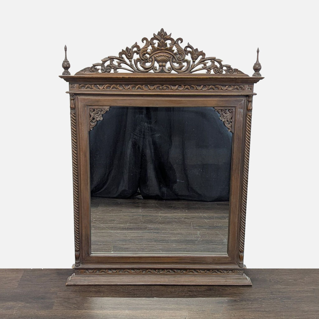 Hand-carved teak mirror from Baan Tawai, Chiang Mai, crafted in 2005, displaying intricate Thai artistry.  