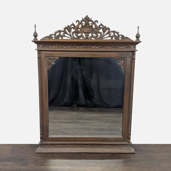 Hand-carved teak mirror from Baan Tawai, Chiang Mai, crafted in 2005, displaying intricate Thai artistry.  
