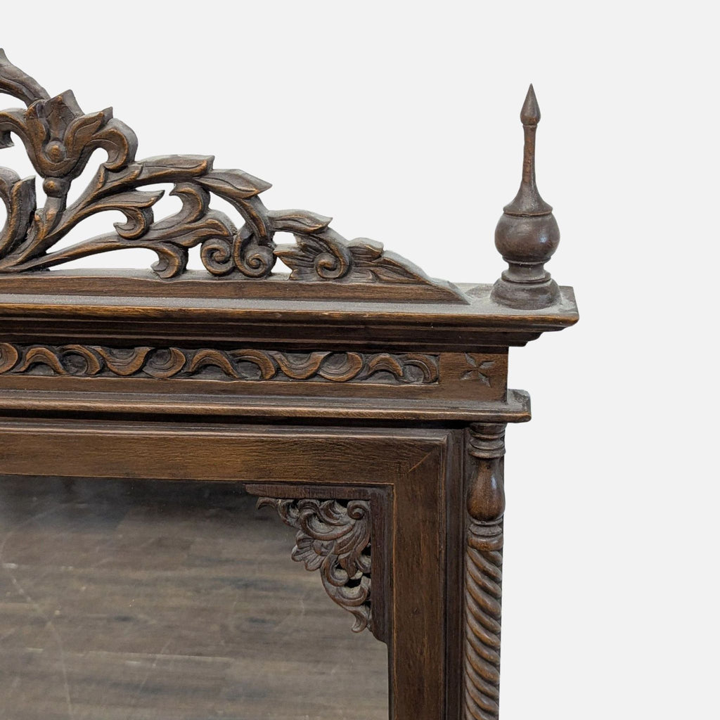 Decorative mirror from Baan Tawai, Thailand; hand-carved teak frame, created in 2005.