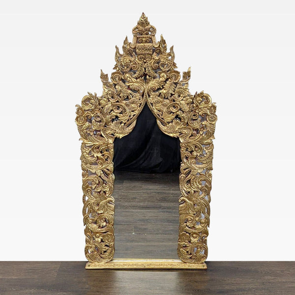 Hand-carved and gilded teak mirror from Baan Tawai, Chiang Mai's renowned handicraft village, made in 2005.