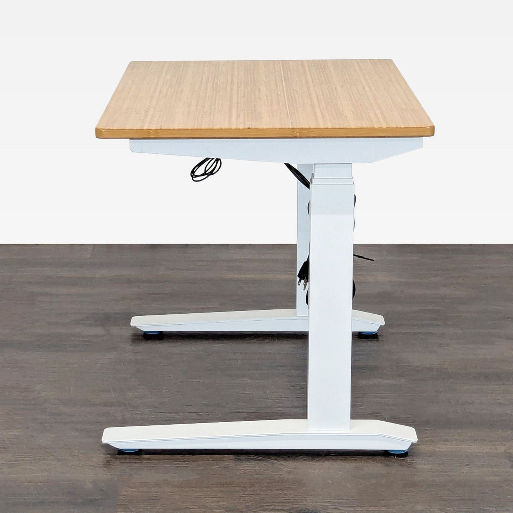 Fully brand sit-stand desk with a white base and bamboo top, offering ergonomic comfort and easy height changes.