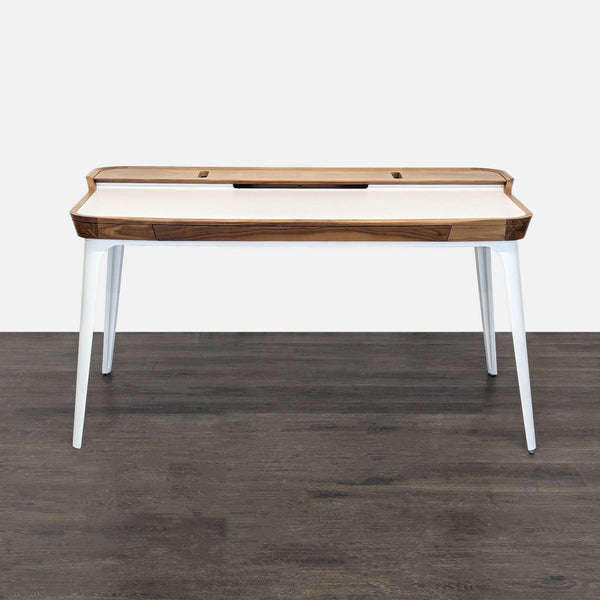 Modern Herman Miller desk with white top, walnut accents, sliding drawer, and sturdy white legs.  