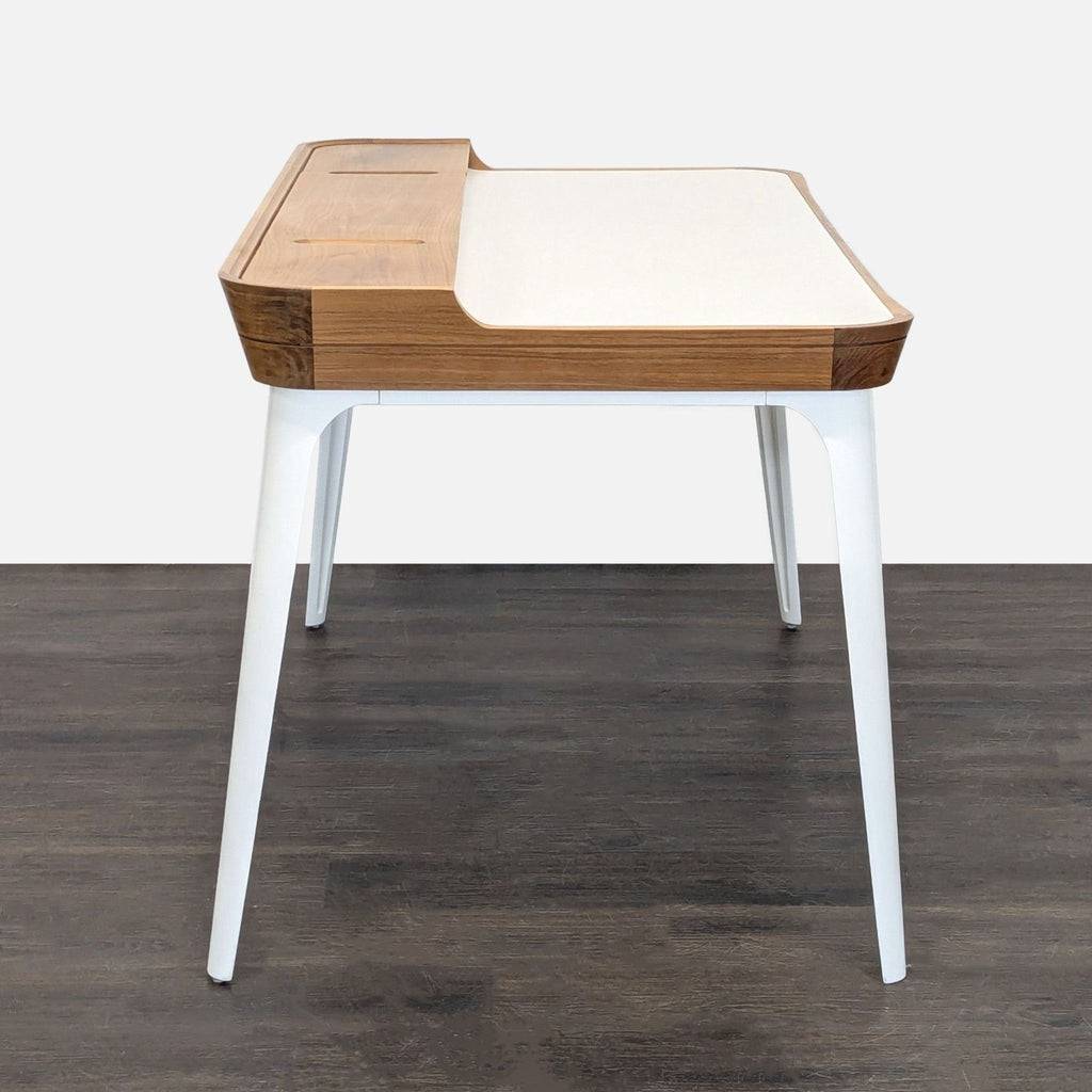 2. Contemporary office desk by Herman Miller featuring a spacious top and sturdy frame, designed for productivity.