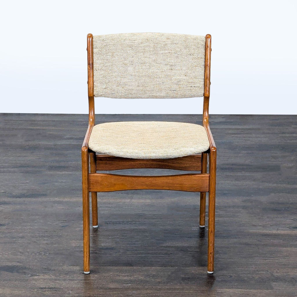 1. Modern wooden dining chair with cushioned seat and slatted backrest, side view.