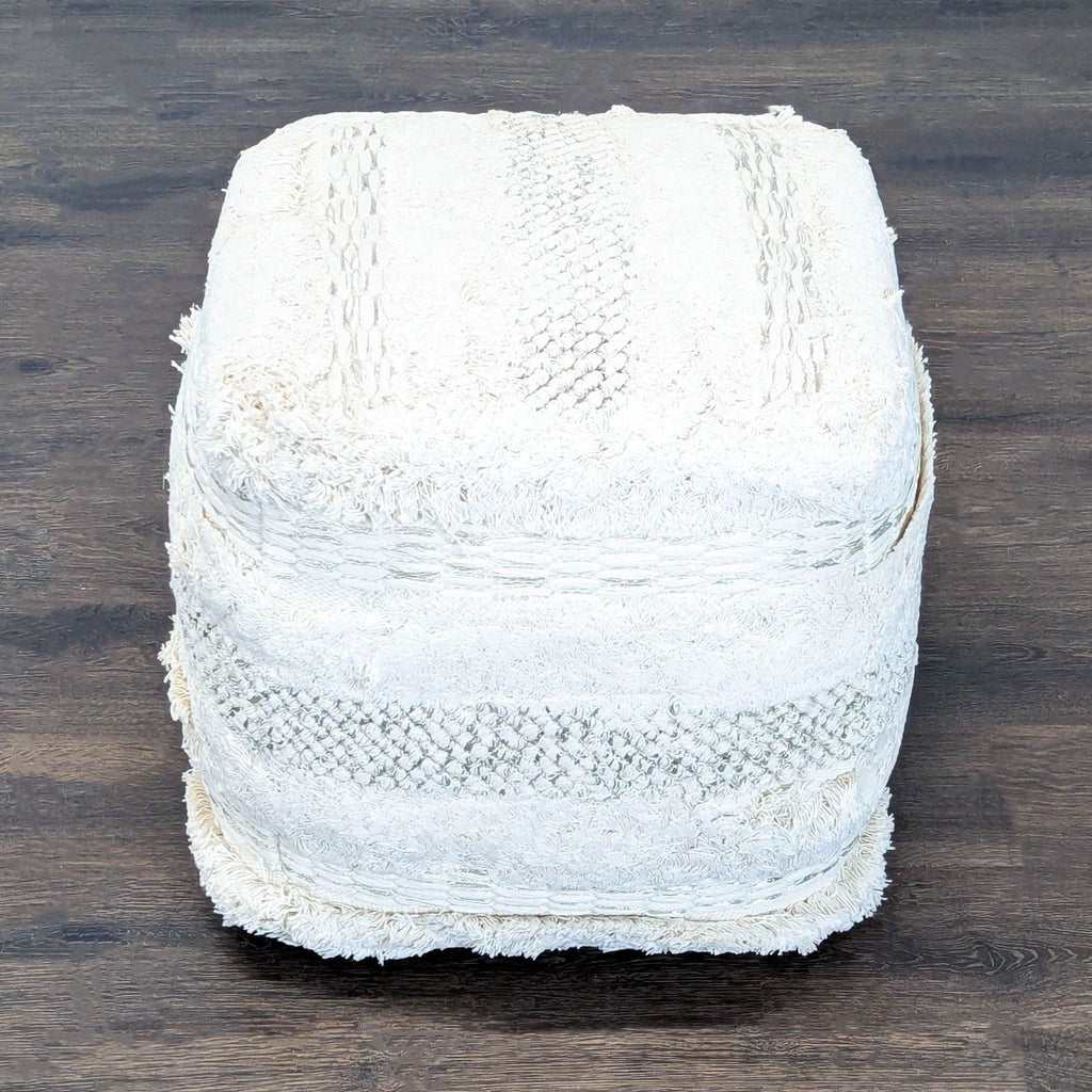Soft, handwoven Yorba pouf by TOV, classified as an ottoman or stool, with a unique boho look.