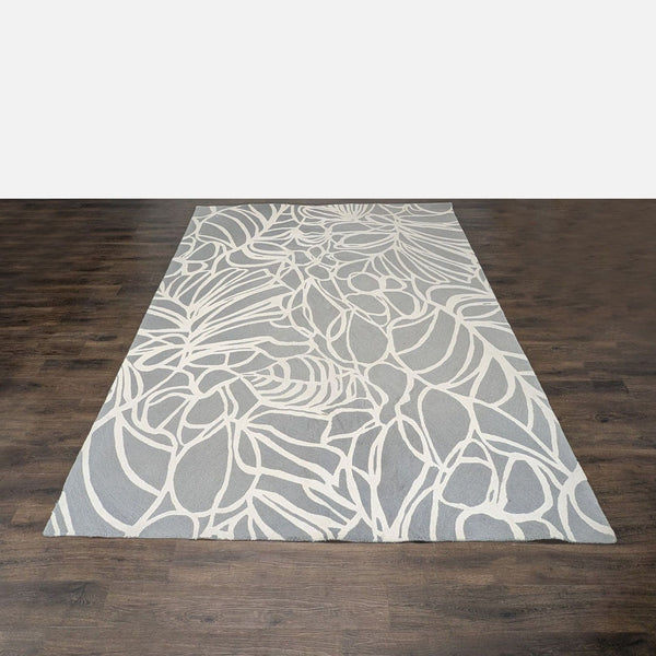 West Elm gray and white abstract rug adds style and comfort to any room, perfect for modern interiors.