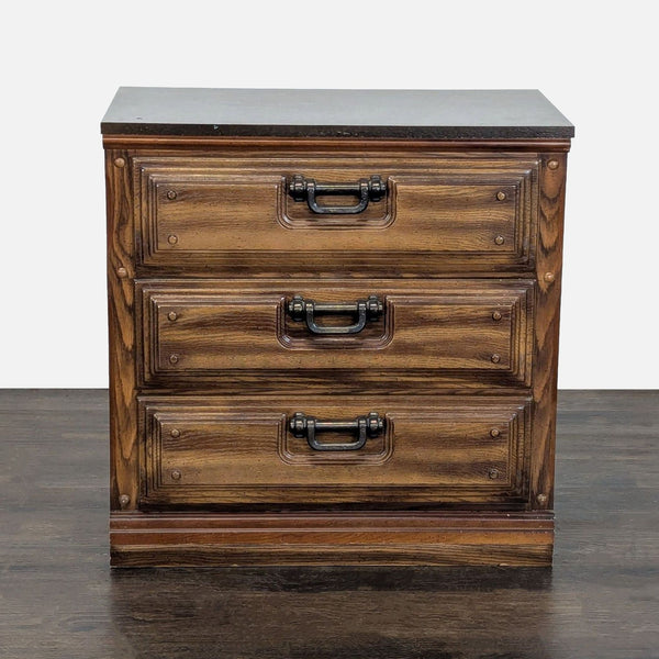 Three-drawer wooden dresser with black handles and a natural finish, suitable for bedrooms or entryways.  