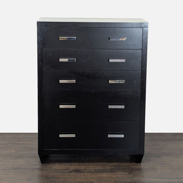 Pottery Barn black dresser with five drawers and metal handles, offering stylish storage for any bedroom.