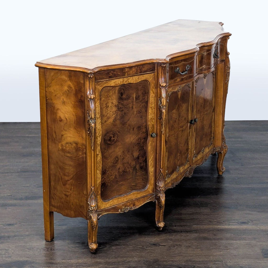 Burl inlay sideboard featuring a wavy carved front, four doors, and a single upper drawer.