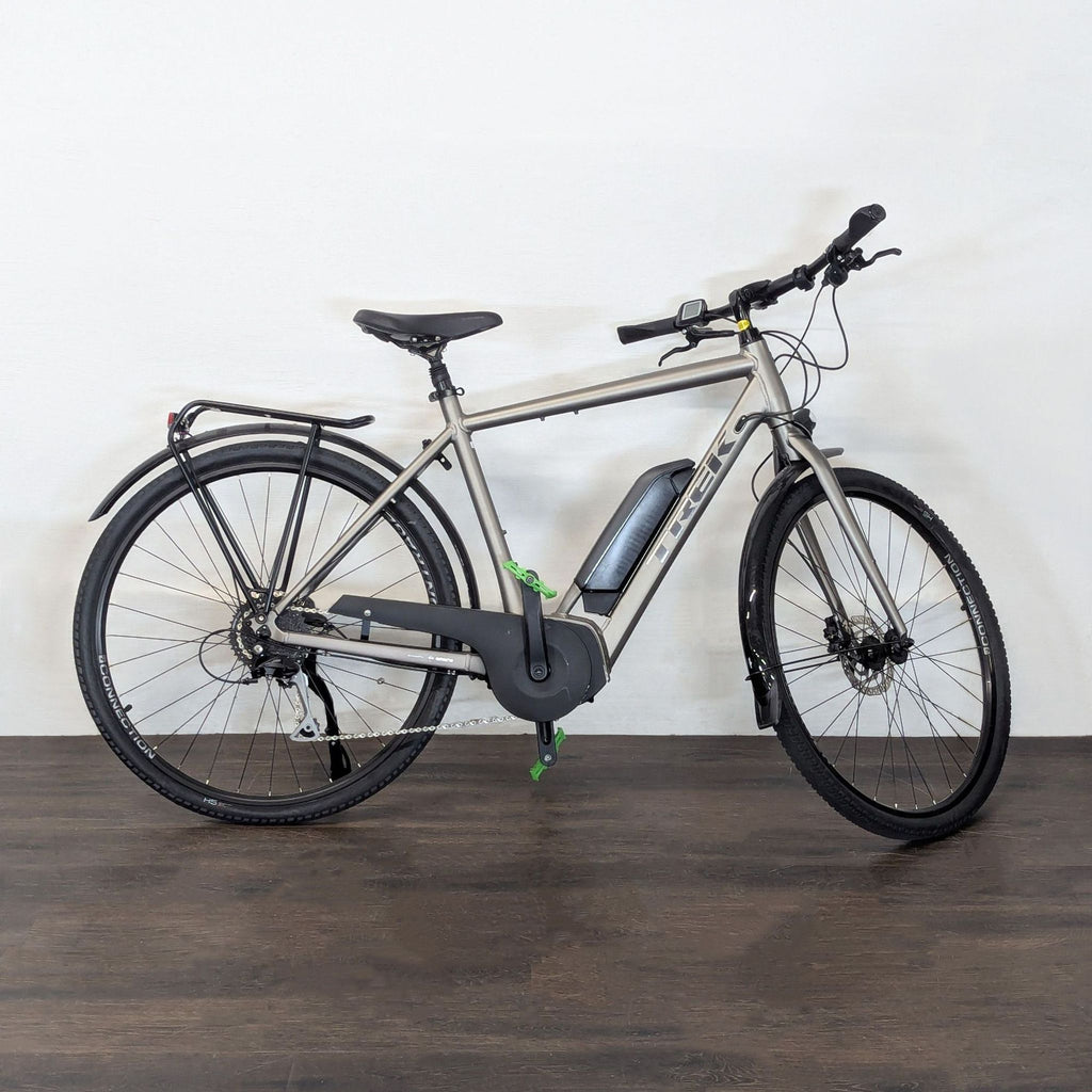 City-ready Trek e-bike features a mid-drive motor, comfortable seat, mounted battery, and safety accessories.  