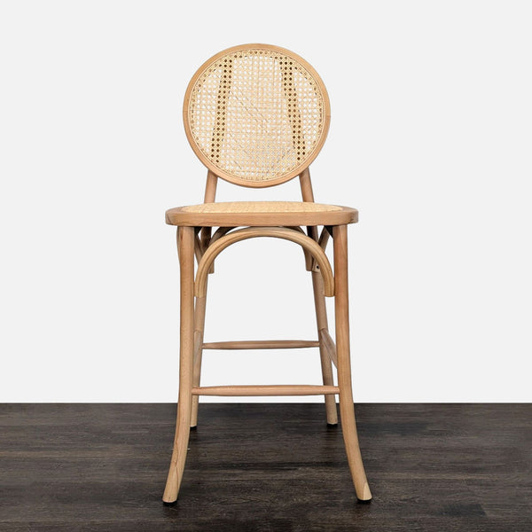 Curved wooden stool featuring cane back and handwoven rattan seat, with an integrated footrest.
