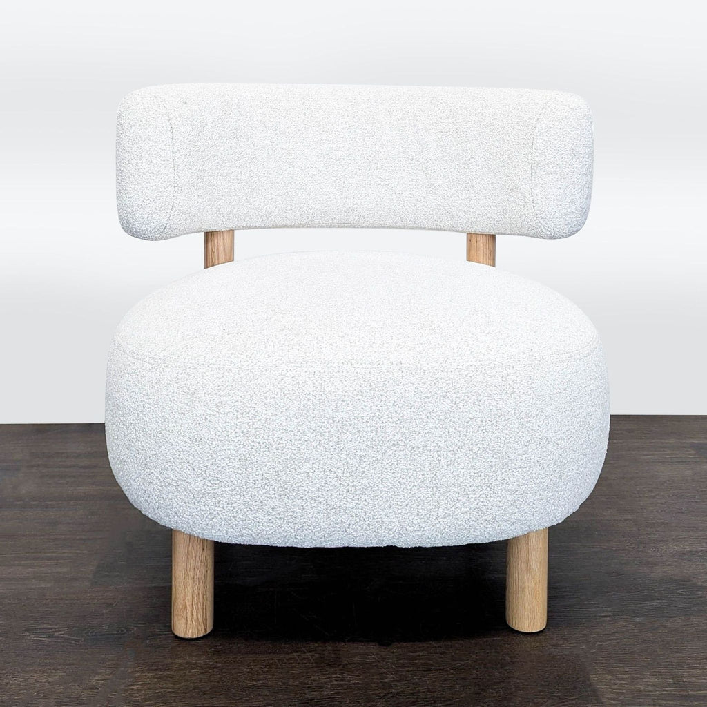 Gray and white Ikea Stockholm 2025 lounge armchair in perfect condition shown in a well-lit room.