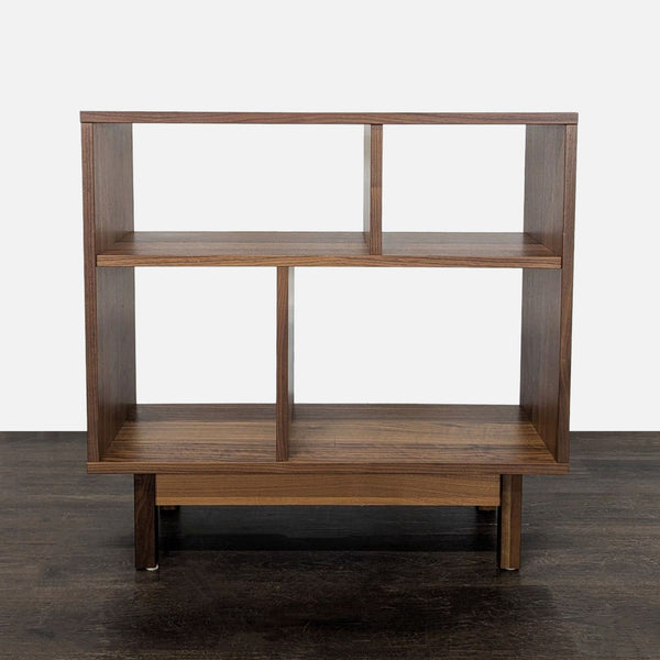 Room & Board wooden bookshelf with open shelves, modern design, and varied spaces for books or decor.  